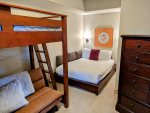Full-size bed in the den bedroom